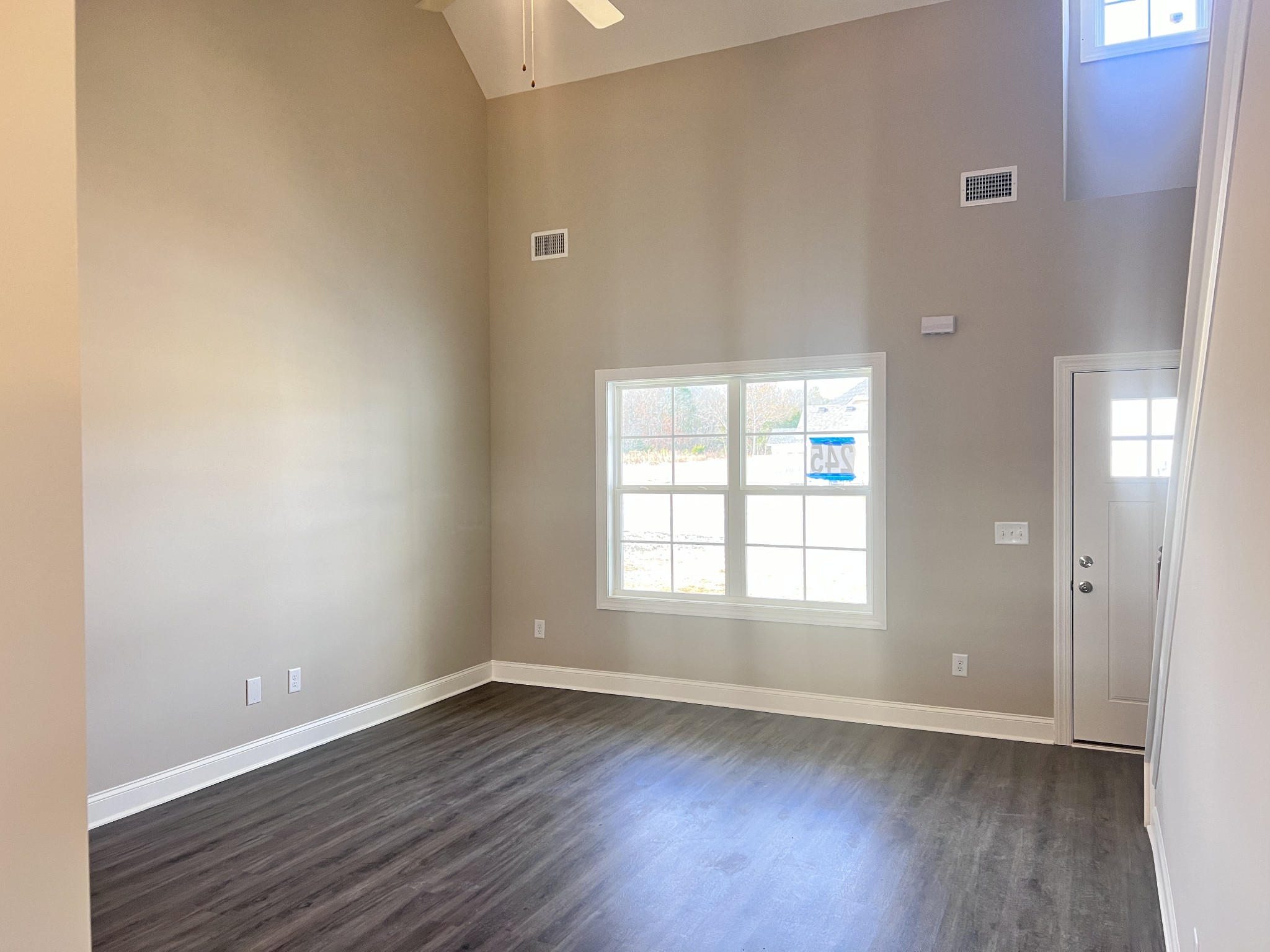 442 Generosity Way Smyrna, TN 37167 - Photo 45 of 59 an empty room with wooden floor and window