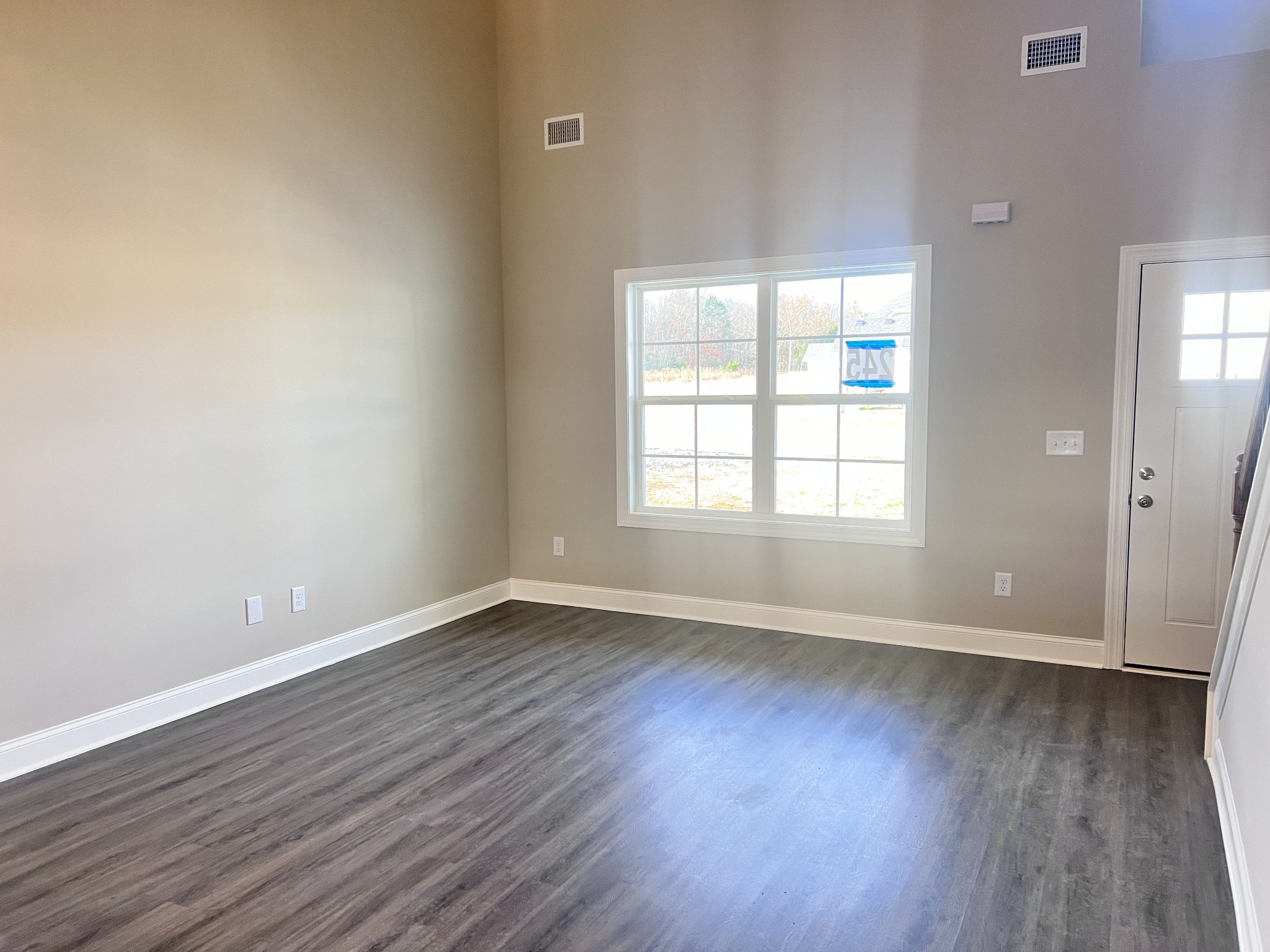 442 Generosity Way Smyrna, TN 37167 - Photo 46 of 59 an empty room with wooden floor and windows