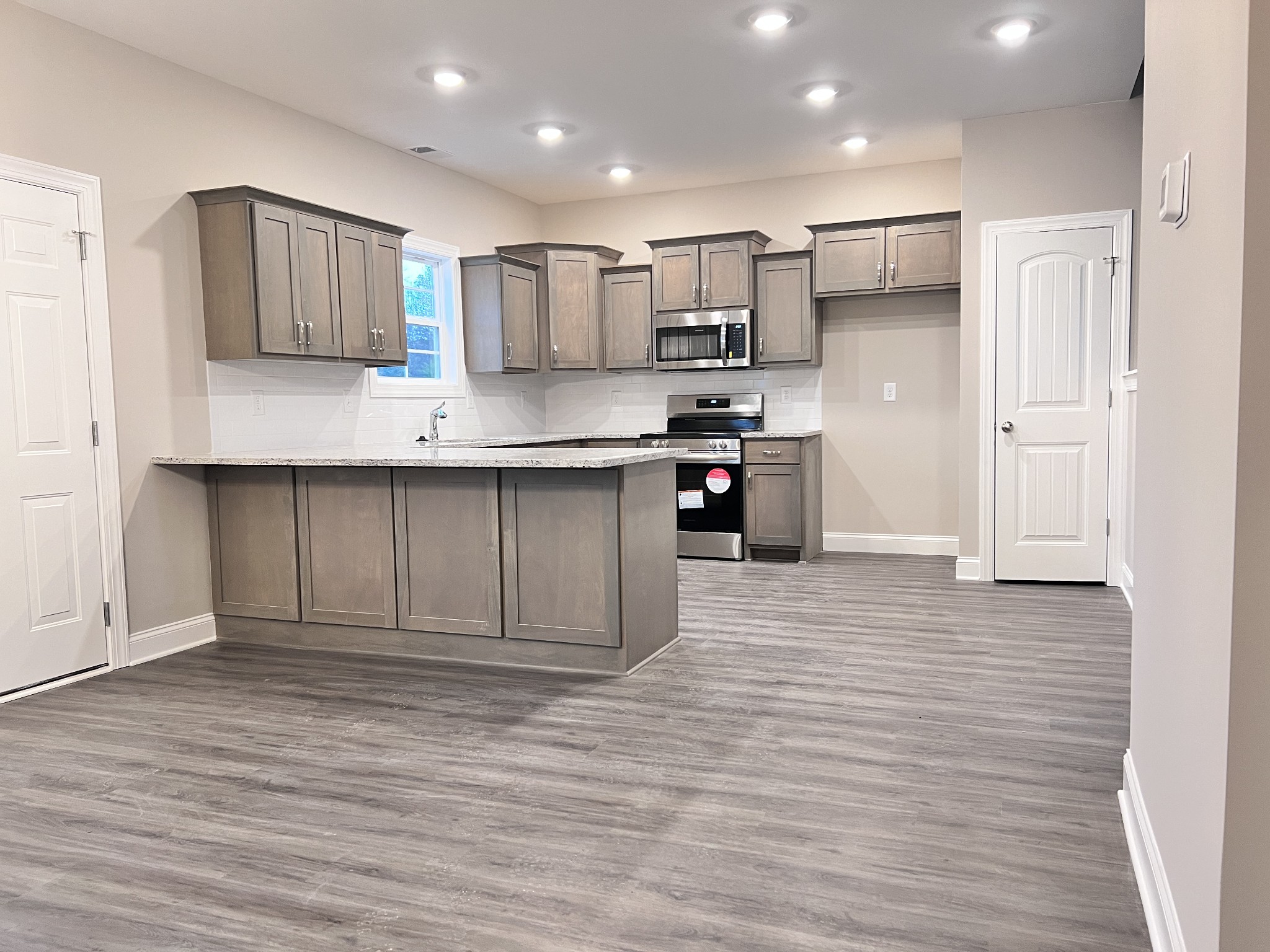 442 Generosity Way Smyrna, TN 37167 - Photo 47 of 59 a kitchen with stainless steel appliances granite countertop a refrigerator and a stove top oven