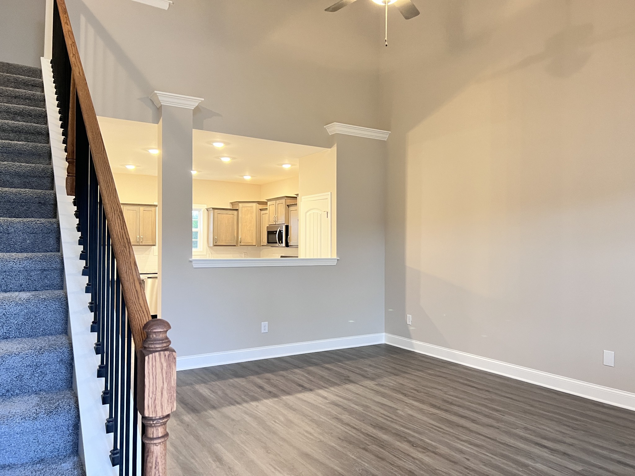 442 Generosity Way Smyrna, TN 37167 - Photo 54 of 59 a view of a hallway with wooden floor and staircase