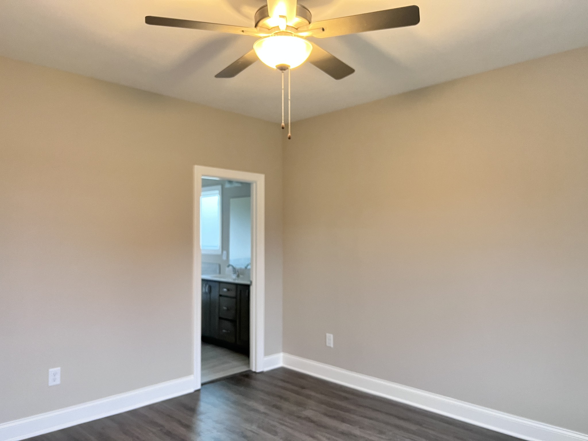 442 Generosity Way Smyrna, TN 37167 - Photo 10 of 59 a view of an empty room with wooden floor and a ceiling fan