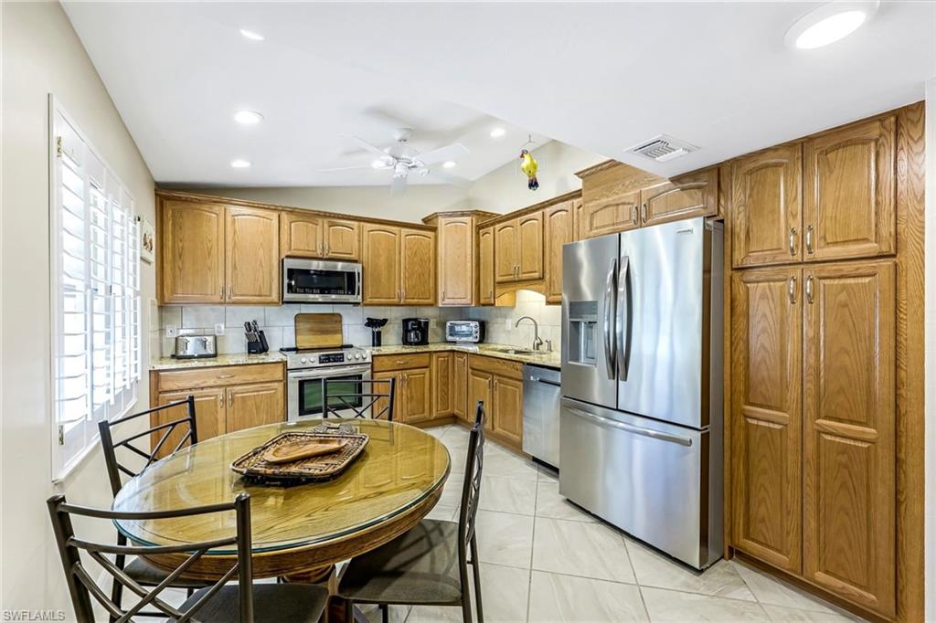 194 Albi Road, Unit 8 Naples, FL 34112 - Photo 8 of 17 Open concept kitchen to dining room
