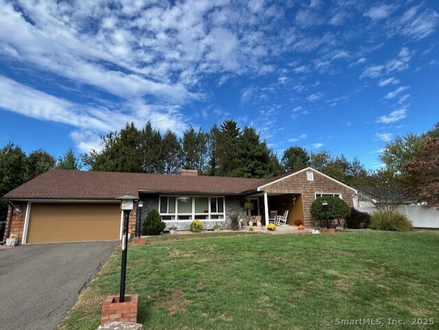 62 Cedarwood Road Berlin, CT 06037 - Photo 1 of 37 a front view of a house with a garden