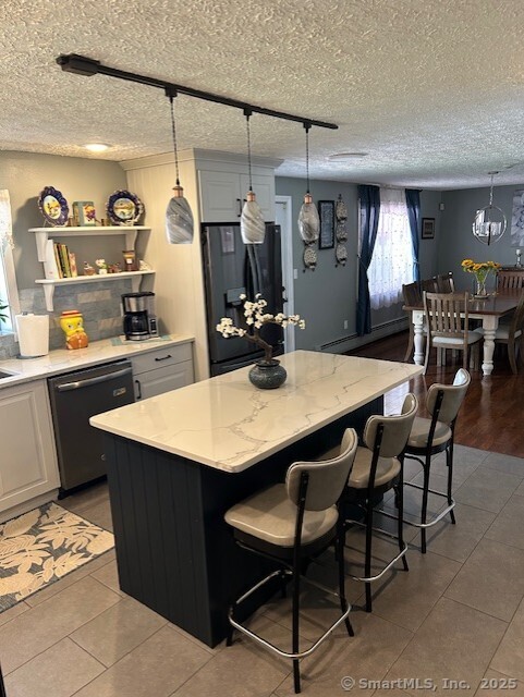62 Cedarwood Road Berlin, CT 06037 - Photo 11 of 37 a dining table with chairs and window