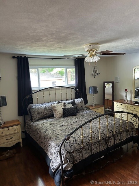 62 Cedarwood Road Berlin, CT 06037 - Photo 17 of 37 a bedroom with a bed and a dresser