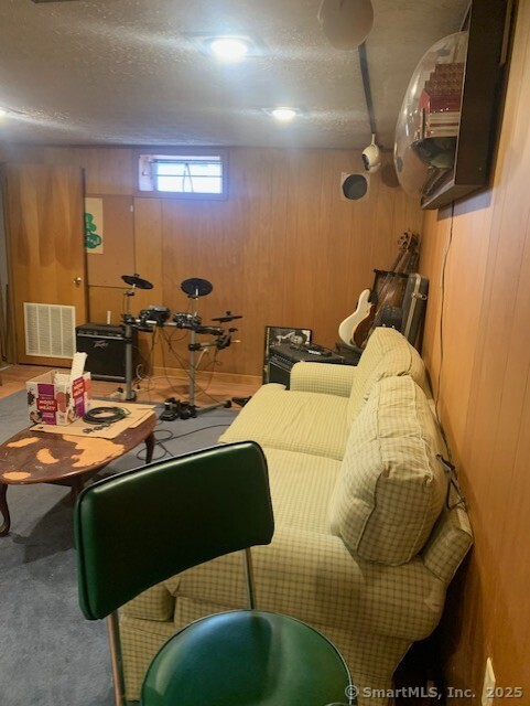 62 Cedarwood Road Berlin, CT 06037 - Photo 23 of 37 a living room with furniture and a mirror