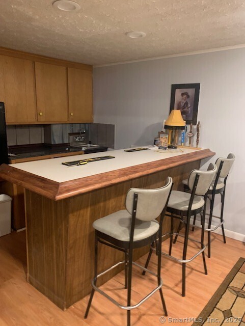 62 Cedarwood Road Berlin, CT 06037 - Photo 27 of 37 a room with a table chairs and a refrigerator