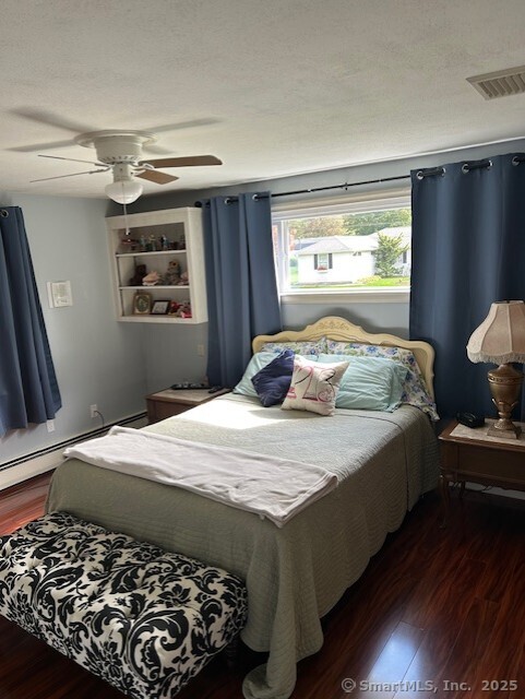 62 Cedarwood Road Berlin, CT 06037 - Photo 33 of 37 a bedroom with a bed and wooden floor