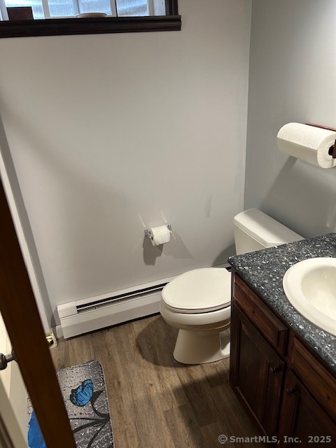 62 Cedarwood Road Berlin, CT 06037 - Photo 36 of 37 a bathroom with a granite countertop toilet and a sink