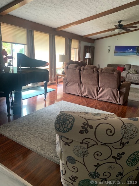 62 Cedarwood Road Berlin, CT 06037 - Photo 5 of 37 a living room with furniture and a flat screen tv