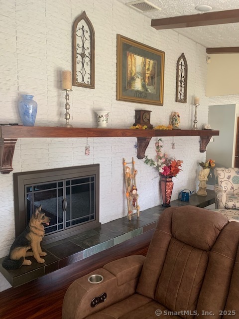 62 Cedarwood Road Berlin, CT 06037 - Photo 6 of 37 a living room with furniture and a fireplace