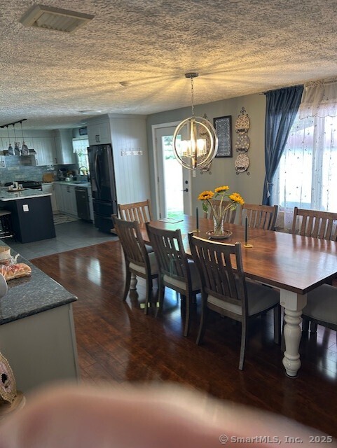 62 Cedarwood Road Berlin, CT 06037 - Photo 8 of 37 a view of a dining room with furniture and window