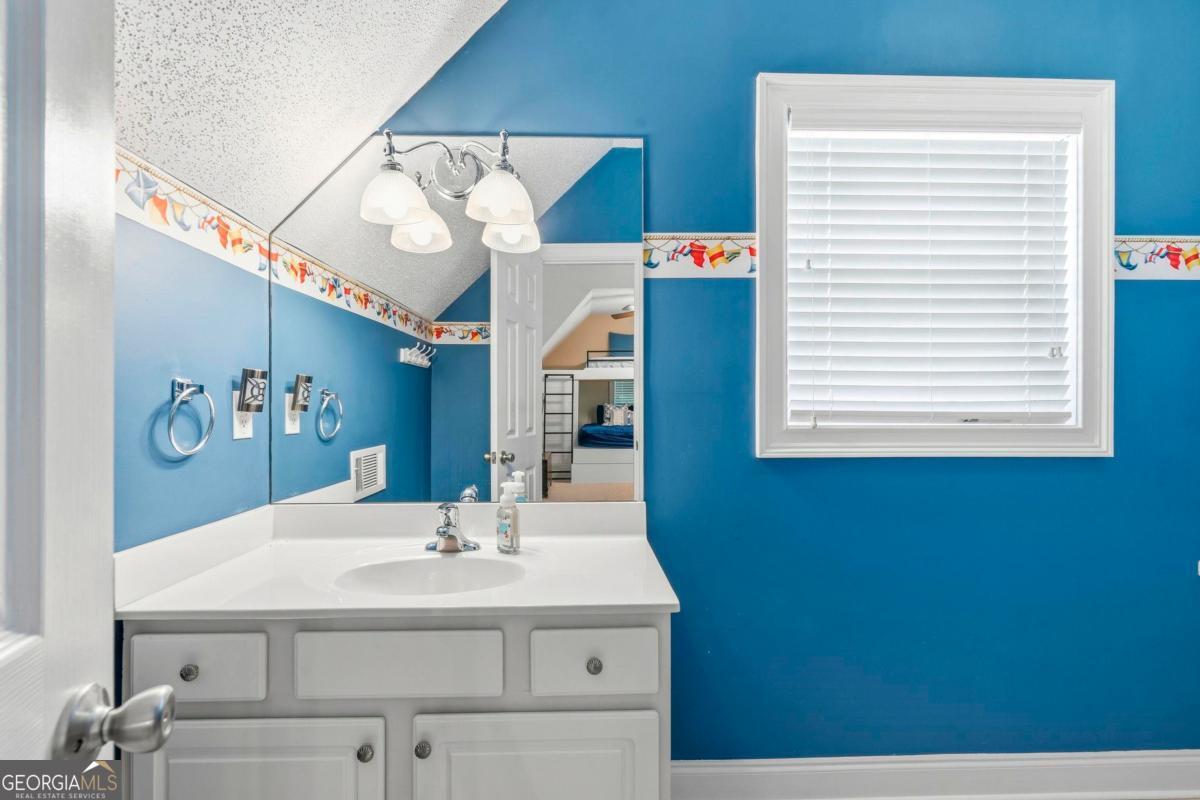 172 Mays Road Milledgeville, GA 31061 - Photo 35 of 54 a bathroom with a sink and a mirror