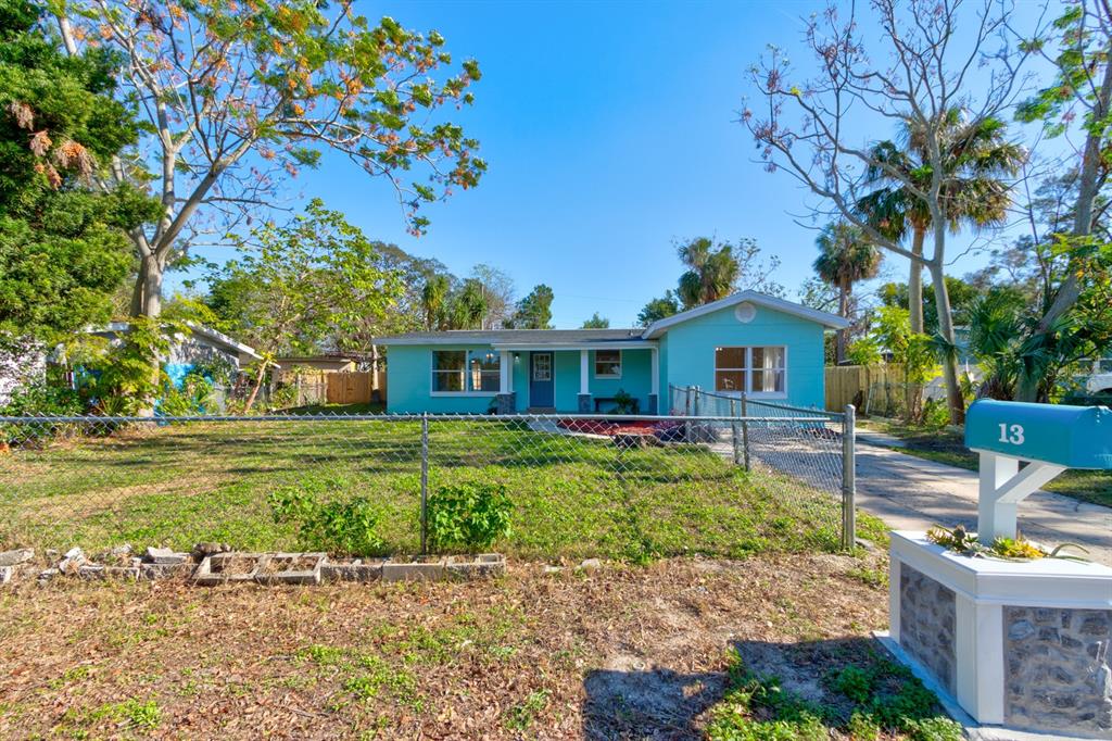 13 Highridge Road Daytona Beach, FL 32117 - Photo 2 of 27 a front view of a house with a garden