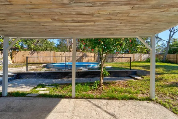a view of a park with wooden fence