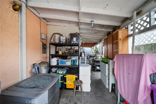 a living room with lots of furniture and a chandelier