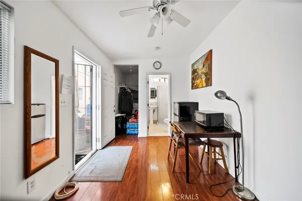 a view of a room with workspace and a window