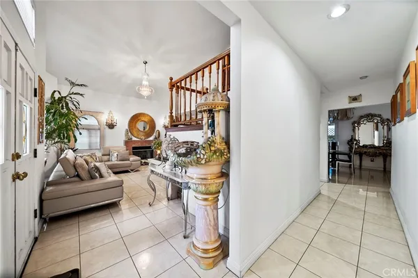 a living room with furniture and a clock