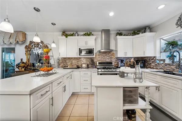 a kitchen with counter space cabinets and appliances