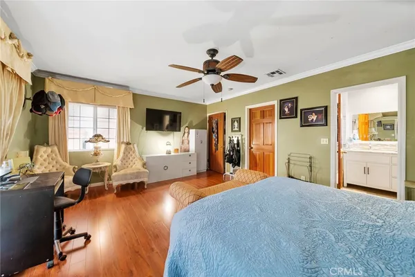 a bed room with furniture and a flat screen tv