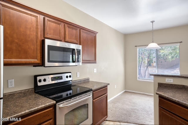 a kitchen with a stove and a microwave