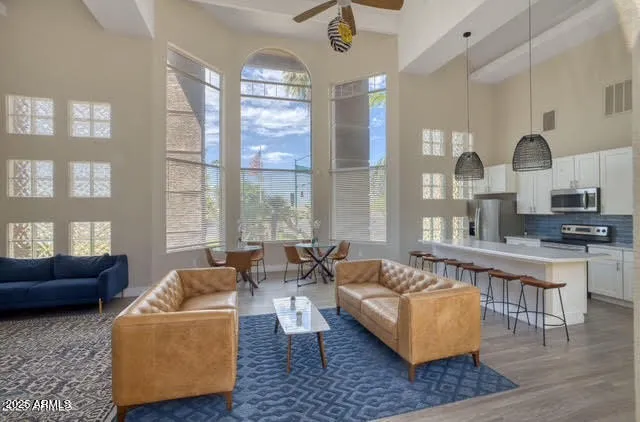 a living room with furniture and a large window