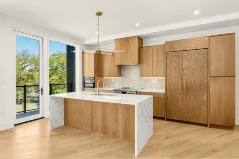 a bathroom with a sink vanity and mirror