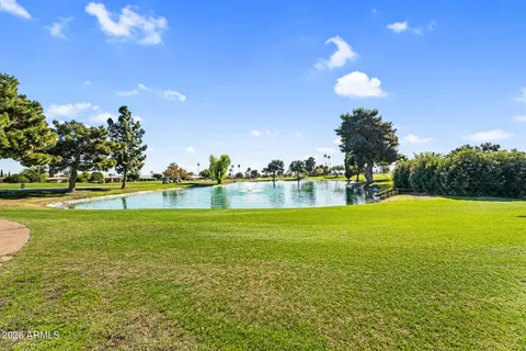 a view of a lake with a big yard