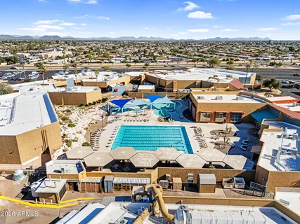 an aerial view of residential houses with outdoor space