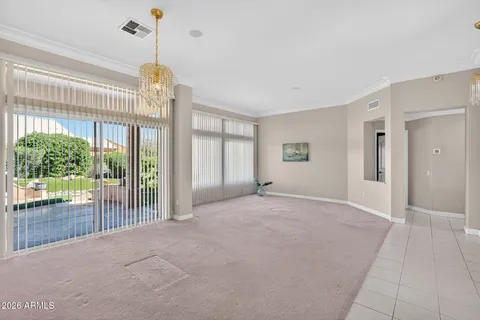 a view of empty room with floor to ceiling windows