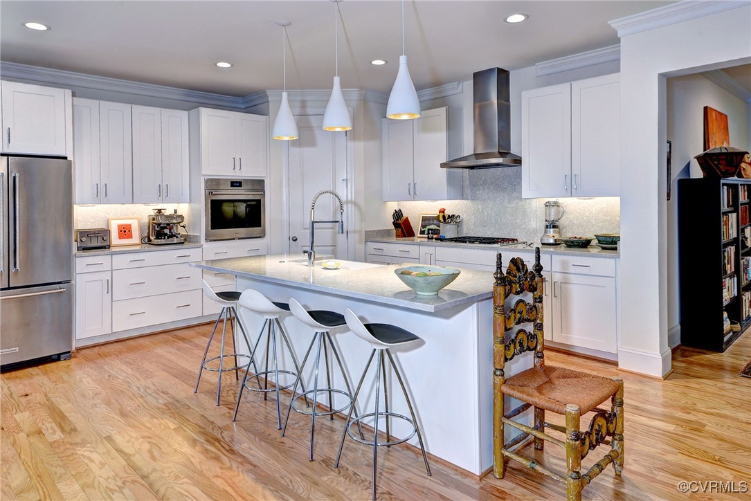112 Nottinghamshire Williamsburg, VA 23188 - Photo 12 of 50 a kitchen with stainless steel appliances a table chairs refrigerator and microwave