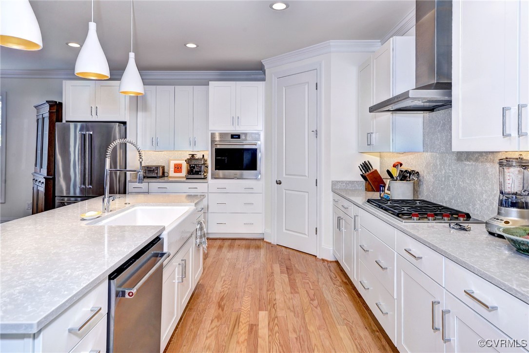 112 Nottinghamshire Williamsburg, VA 23188 - Photo 13 of 50 a kitchen with stainless steel appliances granite countertop a sink stove and refrigerator