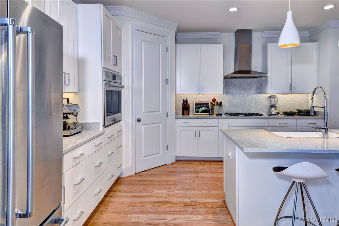 112 Nottinghamshire Williamsburg, VA 23188 - Photo 14 of 50 a kitchen with stainless steel appliances granite countertop a stove a sink and a refrigerator