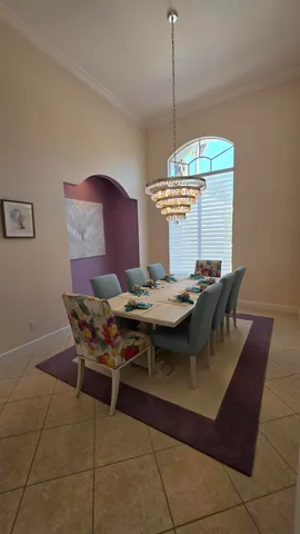 a kitchen with stainless steel appliances granite countertop wooden cabinets a sink dishwasher a stove and a refrigerator