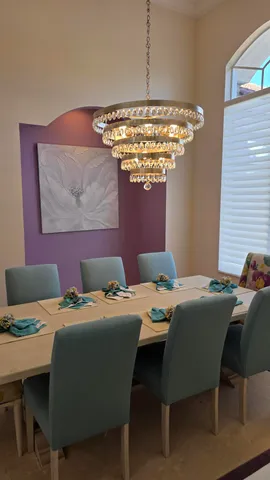 a living room with furniture a flat screen tv and a view of kitchen