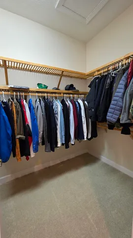a bed sitting in a balcony next to a window