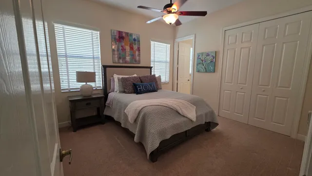 a bathroom with a granite countertop bathtub sink and toilet