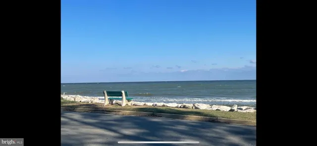 a view of a lake with outdoor seating