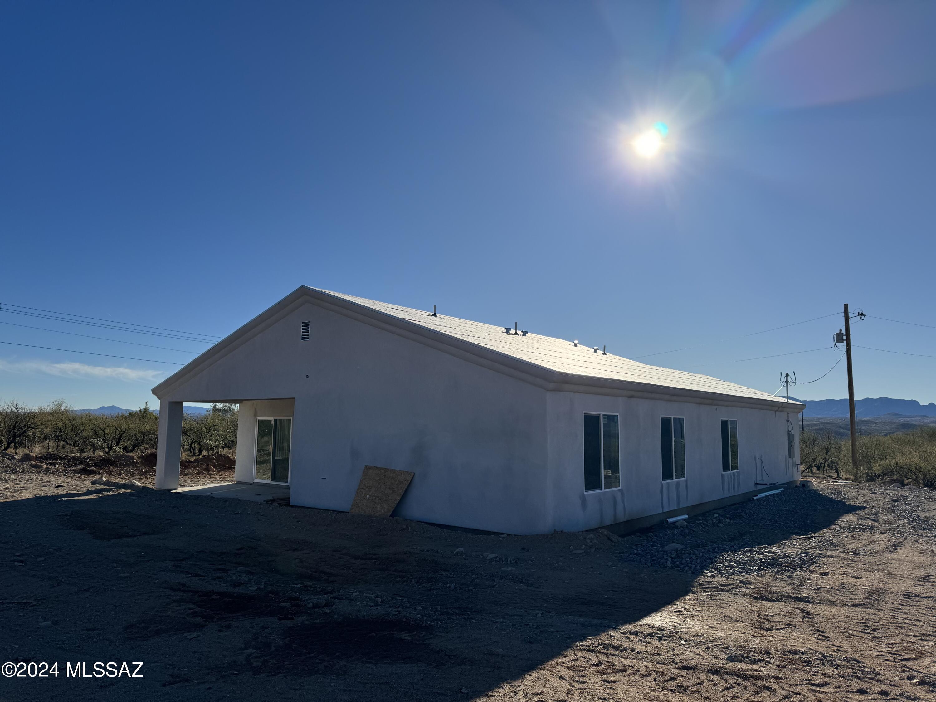 1643 Bala Court Rio Rico, AZ 85648 - Photo 13 of 18 a front view of a house with a yard