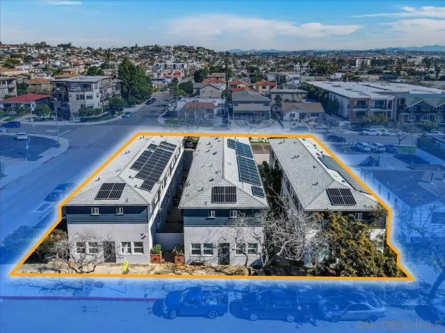a view of swimming pool with outdoor seating and city view