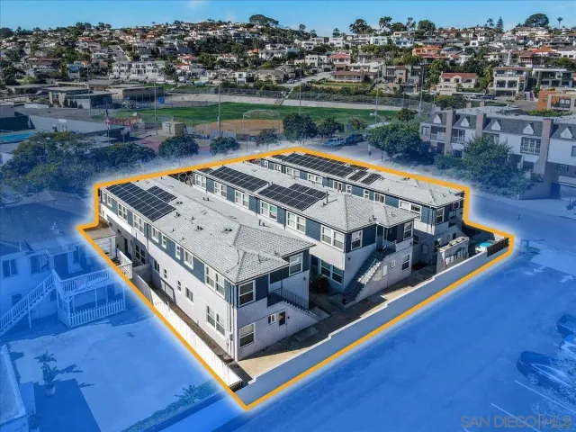 a bed sitting in a roof next to a lake