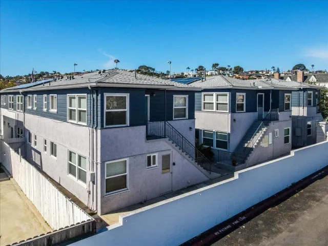 an aerial view of a house with a lake view