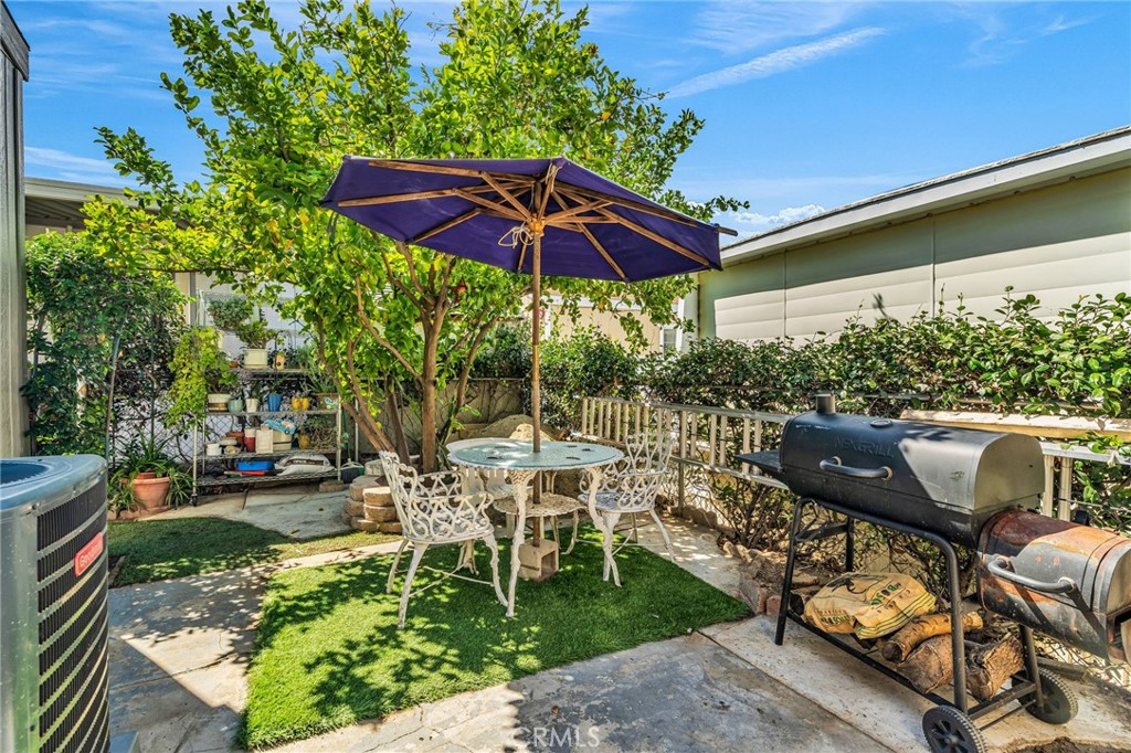 a view of yard with seating area and trees