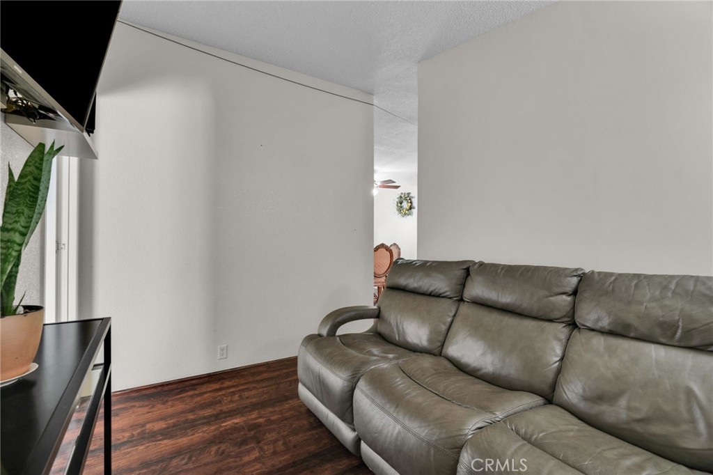20401 Soledad Canyon Road, Unit 139 Canyon Country, CA 91351 - Photo 11 of 35 a living room with furniture and a couch