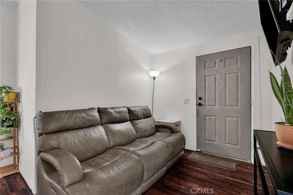 20401 Soledad Canyon Road, Unit 139 Canyon Country, CA 91351 - Photo 13 of 35 a living room with furniture and a flat screen tv