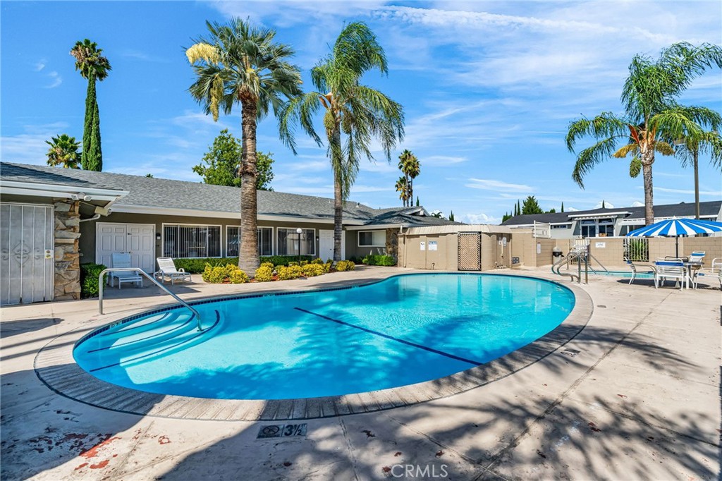 20401 Soledad Canyon Road, Unit 139 Canyon Country, CA 91351 - Photo 29 of 35 a swimming pool with outdoor seating