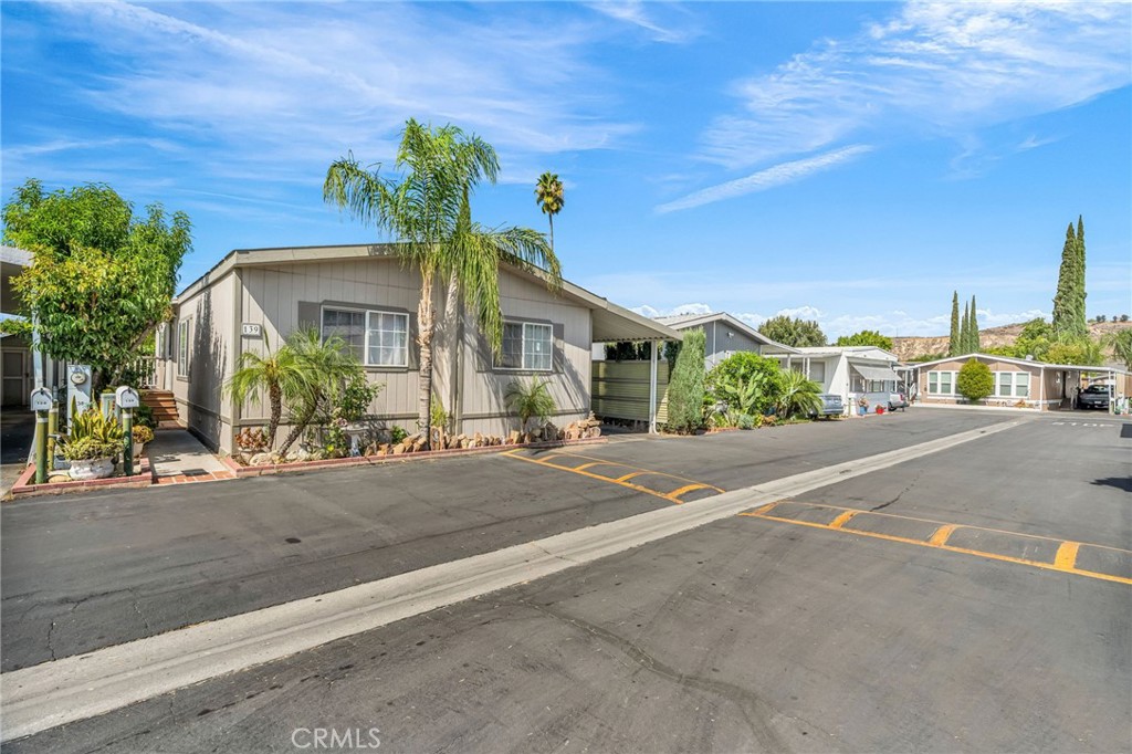 20401 Soledad Canyon Road, Unit 139 Canyon Country, CA 91351 - Photo 3 of 35 a view of a house with a street