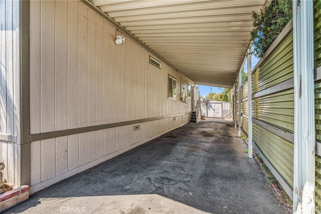 20401 Soledad Canyon Road, Unit 139 Canyon Country, CA 91351 - Photo 34 of 35 a view of a pathway of a house with wooden stairs