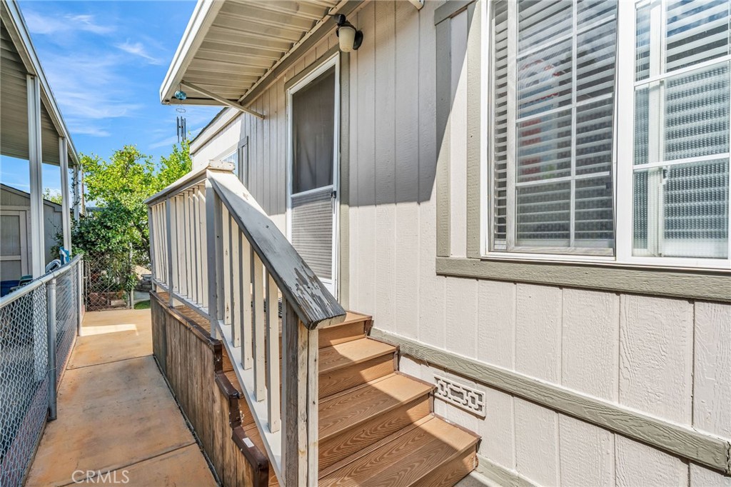 20401 Soledad Canyon Road, Unit 139 Canyon Country, CA 91351 - Photo 6 of 35 a view of balcony with wooden floor and white walls