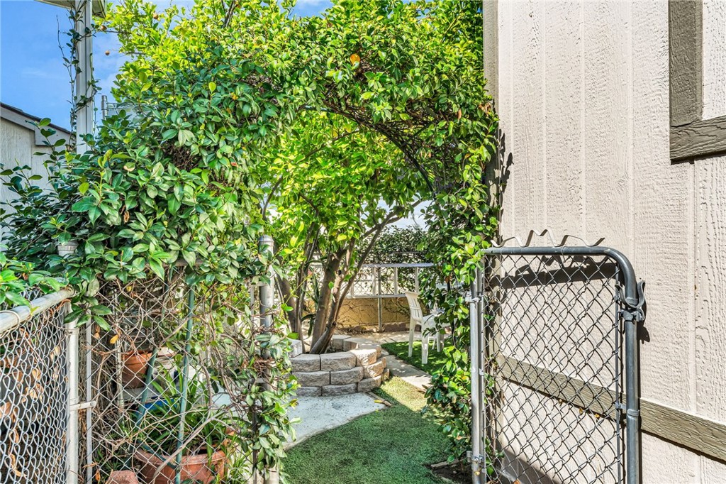 20401 Soledad Canyon Road, Unit 139 Canyon Country, CA 91351 - Photo 7 of 35 a view of a yard with plants and trees